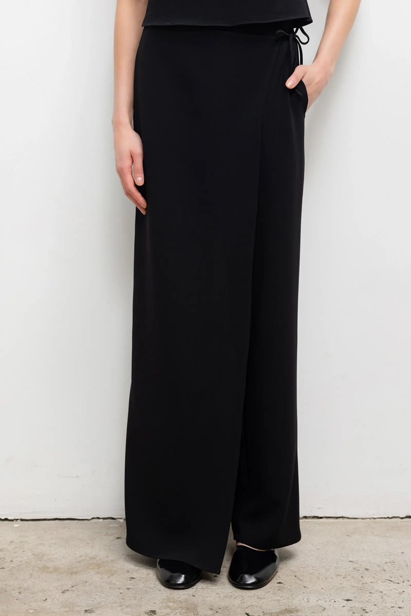 Close up of arielle tie pant in black on model.