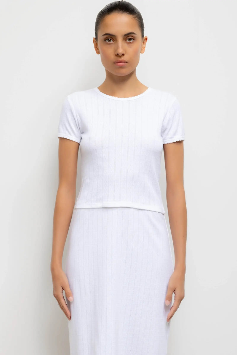 Model is wearing Pointelle Baby Tee in white
