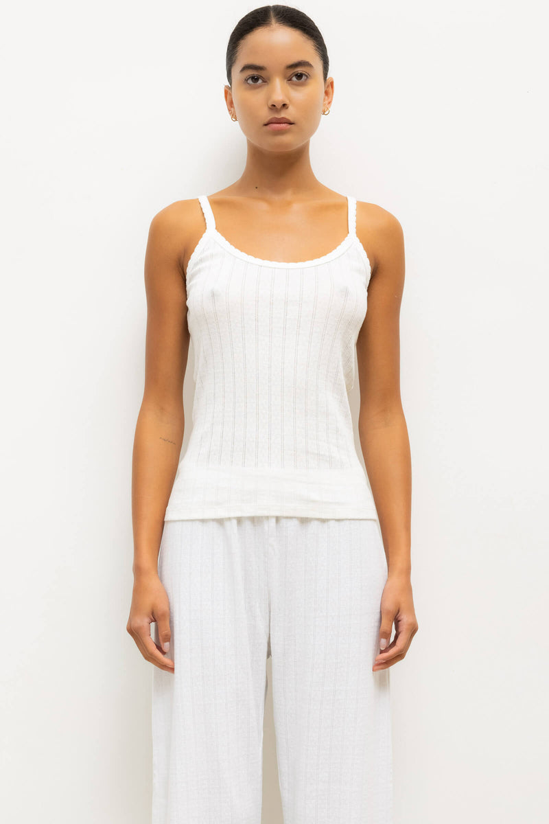 Model is wearing Pointelle tank in white.