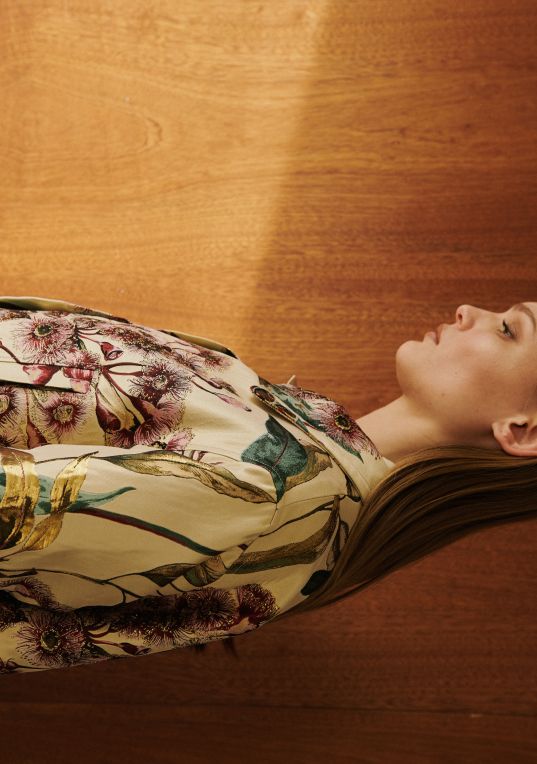 Side view of model is pam floral jacket.