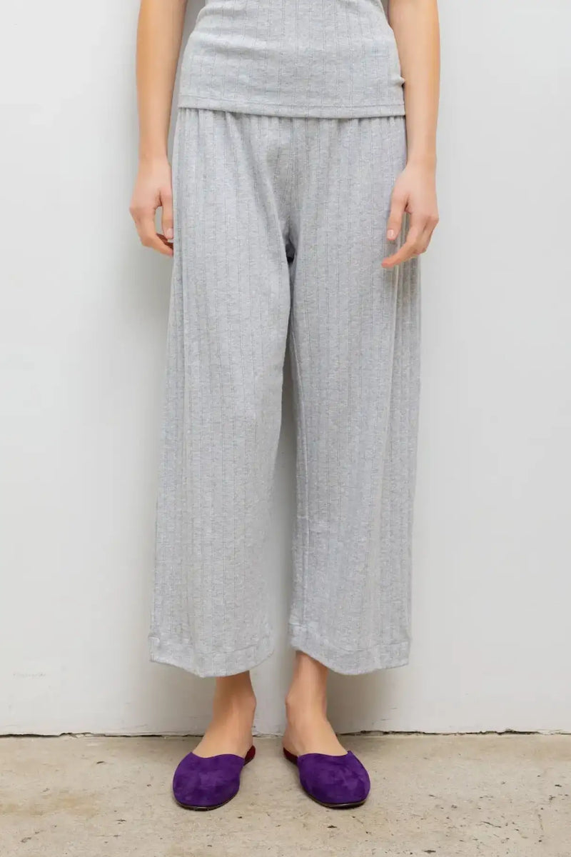 Close up of model wearing the Pointelle crop pocket pant in light grey melange.